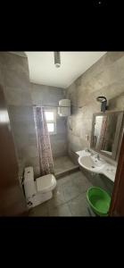 a bathroom with a toilet and a sink at Amwaj amazing see view in Marsa Matruh