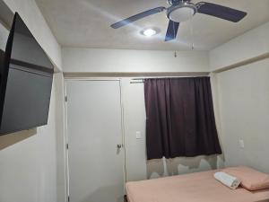 Postel nebo postele na pokoji v ubytování El Padrino