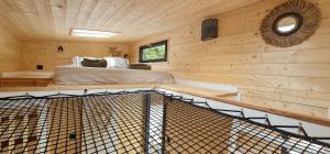 a log cabin with a bed in a room at Amoremio in Peypin +23 photos