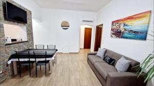 Televízia a/alebo spoločenská miestnosť v ubytovaní Appartamento Sofia a Genova