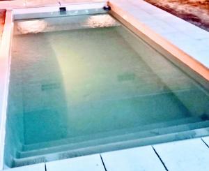 a swimming pool with water in the middle at Arizona in Chascomús