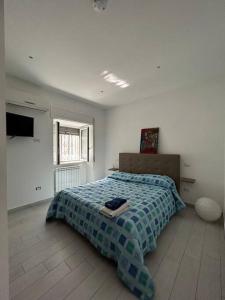 Postel nebo postele na pokoji v ubytování casa Vesuvio