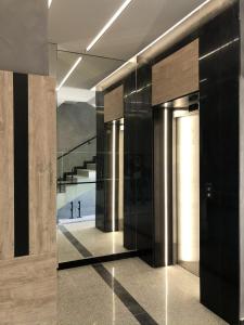 a hallway of a building with a view of the ocean at Sky flats Varna with parking in Varna City