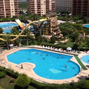 a large swimming pool with a roller coaster at liparis 3 Agritourism & Mediterranean Cuisine , holiday, aquapark , beach in Erdemli