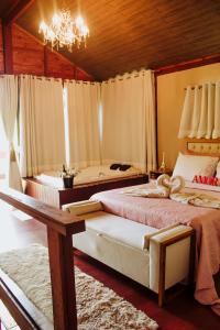 Ein Bett oder Betten in einem Zimmer der Unterkunft Pousada Irmãos Tonoli