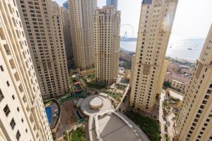 an aerial view of a city with tall buildings at Travel Hub Premium in Dubai