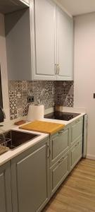 Kuchyň nebo kuchyňský kout v ubytování Faro Comfy Ensuite Guest House