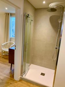 a shower with a glass door in a bathroom at Luxury Apartment St-Tropez/ 10mn walk to center. in Saint-Tropez
