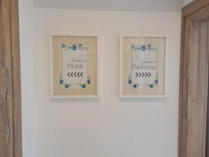 three framed signs on a white wall at Apartment Mara&Padrona in Zadar