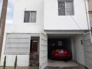 a red car is parked in a garage at Casa Blanca in Reynosa