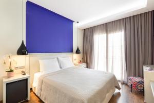 Ένα ή περισσότερα κρεβάτια σε δωμάτιο στο Hotel El Greco 