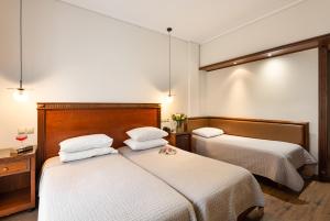 Ένα ή περισσότερα κρεβάτια σε δωμάτιο στο Hotel El Greco 