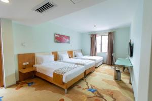Uma cama ou camas num quarto em Shanshui Trends Hotel - Huaqiangbei