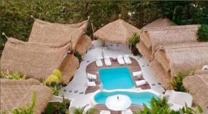 an aerial view of a resort with a swimming pool at Gravity Eco Boutique Hotel - Adults Only in Uluwatu