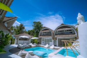 an image of a villa with a swimming pool at Gravity Eco Boutique Hotel - Adults Only in Uluwatu
