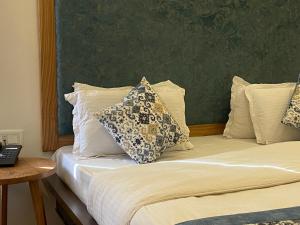 Postel nebo postele na pokoji v ubytování Hotel Palam Hills