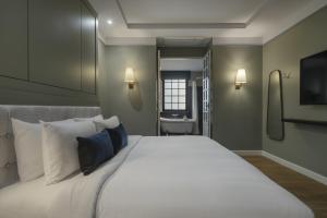 Postel nebo postele na pokoji v ubytování Hotel Thomas Bangkok