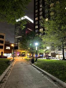 a city street at night with tall buildings at Luxury loft in the heart of downtown Memphis in Memphis