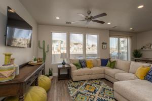 a living room with a couch and a ceiling fan at Greater Zion 9 Bedroom Combined Homes 2302-2298 in Washington