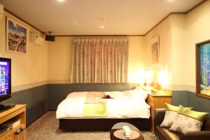 Hotel DOLPHIA-Adult Only客房内的一张或多张床位