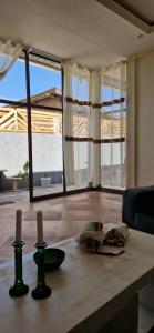 una cocina con una mesa con dos velas. en Light and airy villa in Lalibela, en Lalibela