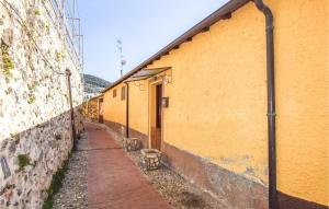 an alleyway next to a yellow building at Stunning Apartment In Ventimiglia in Ventimiglia