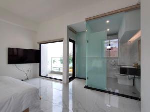 Rúm í herbergi á Kenting Onehome +37 myndir