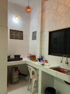 a kitchen with a sink and a counter top at Cassiarata in Phnom Penh