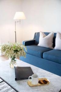 a living room with a couch and a coffee table with a laptop at Clare Country Club in Clare