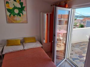 Postel nebo postele na pokoji v ubytování Apartments Ana