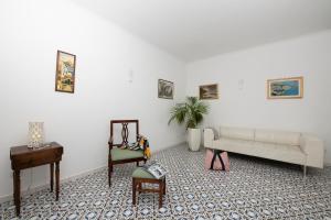a living room with a couch and a table at Casa del Duca in Amalfi