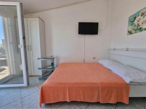 Postel nebo postele na pokoji v ubytování Apartments Ana