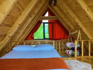 a bedroom with a bed in a attic at Luxury Bungalow With Barbecue2 in Ardeşen