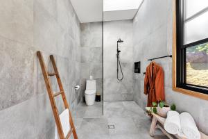 a bathroom with a shower and a toilet at Gan Eden Retreat-Byron bay , luxuries escape in Mullumbimby