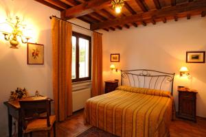 Llit o llits en una habitació de Hotel La Fonte Del Cerro