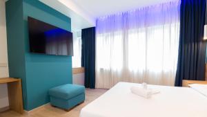 Postel nebo postele na pokoji v ubytování Carducci Art Guesthouse