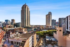 a view of a city with tall buildings at KozyGuru | Sydney CBD | 1Bed Studio | Dis-ney Theme °o° in Sydney +13 photos