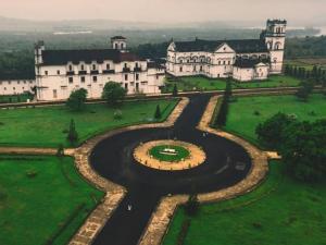 an aerial view of a large building with a fountain at Colva Beach Samaira GuestHouse & Apartments in Colva