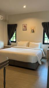 Ένα ή περισσότερα κρεβάτια σε δωμάτιο στο Trat Tara Boutique Hotel +9 φωτογραφίες