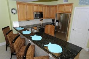 a kitchen with a counter with whale decals on it at Azure 418-Glorious Gulf-Front Views- Luxury 4 Bdrm in Fort Walton Beach