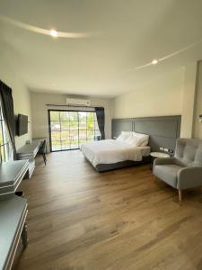 Ένα ή περισσότερα κρεβάτια σε δωμάτιο στο Trat Tara Boutique Hotel