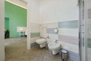 a bathroom with a toilet and a sink at Villa Caterina b&b in Procida