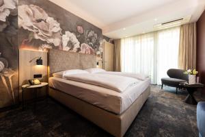 Postel nebo postele na pokoji v ubytování Hotel Vier Jahreszeiten Loipersdorf + 29 fotografií
