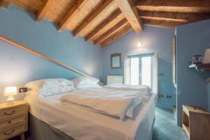 Giường trong phòng chung tại Ca' di Martino