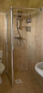 a bathroom with a shower and a toilet and a sink at Townhouse at Harlepool Marina in Hartlepool