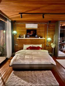 מיטה או מיטות בחדר ב-Butiq Garden