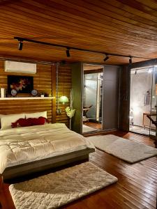 מיטה או מיטות בחדר ב-Butiq Garden