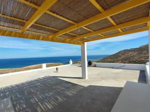 a view from the deck of a house overlooking the ocean at Maison vue mer, île de Zembra et montagne en Tunisie - Elhaouaria in El Haouaria