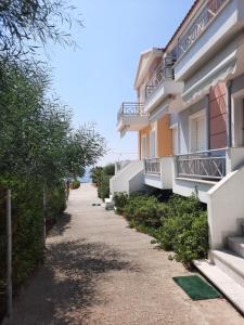 a street in front of a building at Argo Apartments in Vatera