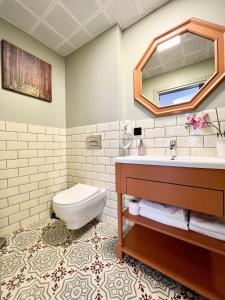 a bathroom with a sink and a toilet at The House Company in Istanbul